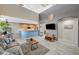 Open living room featuring a breakfast bar, providing a seamless transition to the kitchen at 317 Shimmering Moon St, Henderson, NV 89015