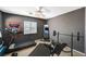 Well-equipped workout room featuring a treadmill, weight rack, and full-length mirror at 317 Shimmering Moon St, Henderson, NV 89015