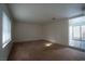 Inviting bedroom with plush carpet and window bringing in natural light at 3467 Garden East Dr, Las Vegas, NV 89121
