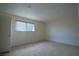 Comfortable bedroom with neutral carpeting, a window, and ample natural light at 3467 Garden East Dr, Las Vegas, NV 89121