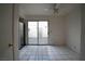 Bright dining area with tile flooring, black refrigerator, and sliding doors to private patio at 3467 Garden East Dr, Las Vegas, NV 89121