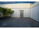 Private outdoor patio with palm tree feature surrounded by white fencing at 3467 Garden East Dr, Las Vegas, NV 89121