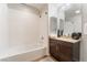 Clean bathroom featuring a shower-tub combo with a granite-topped vanity at 353 E Bonneville Ave # 746, Las Vegas, NV 89101