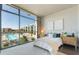 Sun-drenched bedroom with a serene pool view, comfortable bed, and contemporary decor at 353 E Bonneville Ave # 746, Las Vegas, NV 89101