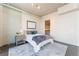 Bedroom featuring a comfortable bed, soft lighting, and a glimpse into an organized walk-in closet at 353 E Bonneville Ave # 746, Las Vegas, NV 89101