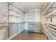 Organized walk-in closet with metal shelving, hanging rods, and ample storage space at 353 E Bonneville Ave # 746, Las Vegas, NV 89101