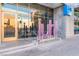 Juhl condos entrance featuring modern signage and glass doors to the main lobby at 353 E Bonneville Ave # 746, Las Vegas, NV 89101
