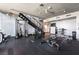 Well-equipped gym with weight machines, free weights, and staircase to another level at 353 E Bonneville Ave # 746, Las Vegas, NV 89101
