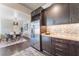 Gourmet kitchen featuring stainless steel appliances, wine rack, and adjacent dining area at 353 E Bonneville Ave # 746, Las Vegas, NV 89101