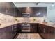 Modern kitchen with stainless steel appliances, ample cabinetry, and tiled backsplash at 353 E Bonneville Ave # 746, Las Vegas, NV 89101