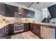 Well-equipped kitchen with stainless steel appliances, granite countertops, and stylish backsplash at 353 E Bonneville Ave # 746, Las Vegas, NV 89101