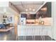 Modern kitchen with a breakfast bar, stainless steel appliances, and sleek cabinetry at 353 E Bonneville Ave # 746, Las Vegas, NV 89101