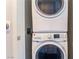 Stacked washer and dryer provide space-saving convenience in the laundry area at 353 E Bonneville Ave # 746, Las Vegas, NV 89101
