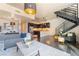 Bright and airy living room featuring modern furnishings, a stylish staircase, and an open floor plan at 353 E Bonneville Ave # 746, Las Vegas, NV 89101