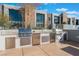 Outdoor kitchen equipped with stainless steel appliances and counter space for entertaining at 353 E Bonneville Ave # 746, Las Vegas, NV 89101