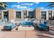 Outdoor lounge area with plush seating and a fire pit for cozy evenings at 353 E Bonneville Ave # 746, Las Vegas, NV 89101