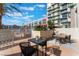 Inviting outdoor patio with modern furniture and lush greenery near the pool area at 353 E Bonneville Ave # 746, Las Vegas, NV 89101