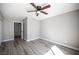 Bright bedroom with wood-look floors and neutral colored walls at 3809 Champagne Wood Dr, North Las Vegas, NV 89031