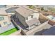 Aerial view of the home showing the backyard with turf and covered patio at 389 Scarlet Pine Ct, Henderson, NV 89044