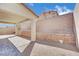View of the covered patio and landscaped retaining wall in the backyard of the property at 389 Scarlet Pine Ct, Henderson, NV 89044