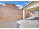 Backyard patio with pavers and a retaining wall, offering privacy and outdoor space at 389 Scarlet Pine Ct, Henderson, NV 89044