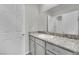 Bathroom featuring granite countertops and a large mirror above the vanity at 389 Scarlet Pine Ct, Henderson, NV 89044