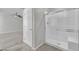 A modern bathroom with a glass-enclosed shower and seat, showcasing contemporary design and comfort at 389 Scarlet Pine Ct, Henderson, NV 89044
