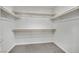 Walk-in closet with built-in shelving and carpet, offering plenty of storage space at 389 Scarlet Pine Ct, Henderson, NV 89044
