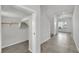 View of the entryway and closet with tile floors and bright, neutral paint, with ample storage space at 389 Scarlet Pine Ct, Henderson, NV 89044