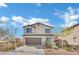 Charming home showcasing a well-manicured front yard and a two-car garage at 389 Scarlet Pine Ct, Henderson, NV 89044