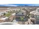 Inviting two-story home featuring desert landscaping and a neutral color scheme at 389 Scarlet Pine Ct, Henderson, NV 89044