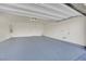 Spacious garage with a painted floor and an overhead garage door at 389 Scarlet Pine Ct, Henderson, NV 89044