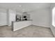 Modern kitchen featuring granite countertops, stainless steel appliances, tile floors and neutral paint at 389 Scarlet Pine Ct, Henderson, NV 89044