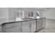 Granite kitchen island featuring modern appliances and cabinetry in a well-lit, open-concept living space at 389 Scarlet Pine Ct, Henderson, NV 89044