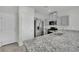 The kitchen features stainless steel appliances, granite countertops, and neutral cabinets at 389 Scarlet Pine Ct, Henderson, NV 89044