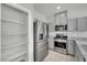 Kitchen view features ample storage space, stainless steel appliances, and bright lighting at 389 Scarlet Pine Ct, Henderson, NV 89044