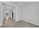 Bright living room featuring neutral paint, tile floors, and open floorplan at 389 Scarlet Pine Ct, Henderson, NV 89044