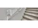A carpeted staircase leads to a lower level, offering both practicality and aesthetic appeal at 389 Scarlet Pine Ct, Henderson, NV 89044