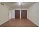 Plank floored bedroom with ceiling fan and closet space at 401 Altamira Rd, Las Vegas, NV 89145