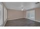 A bright bedroom with gray wood-look flooring, a ceiling fan, and shuttered windows allowing natural light at 401 Altamira Rd, Las Vegas, NV 89145