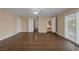Unstaged bedroom showing multiple entryways, plank floor and bright windows at 401 Altamira Rd, Las Vegas, NV 89145
