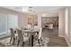 Open dining room showcases a modern glass table, stylish rug, and plantation shutters for enhanced natural light at 401 Altamira Rd, Las Vegas, NV 89145