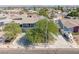 Two-story home with a balcony, mature trees, and a boat parked in the driveway at 401 Altamira Rd, Las Vegas, NV 89145