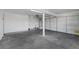 A spacious two car garage with concrete floors and white walls at 401 Altamira Rd, Las Vegas, NV 89145