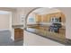 Close-up of kitchen showcases granite countertops, stainless steel appliances, and ample cabinet space at 401 Altamira Rd, Las Vegas, NV 89145