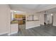 Open-concept kitchen featuring wood cabinets, granite countertops, and stainless steel appliances, great for cooking at 401 Altamira Rd, Las Vegas, NV 89145