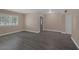 Bright living room with updated flooring, natural light, and neutral wall colors at 401 Altamira Rd, Las Vegas, NV 89145