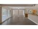 Open living space with access to a patio, adjoining rooms, and hardwood floors at 401 Altamira Rd, Las Vegas, NV 89145
