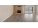 Bright living room featuring a fireplace and sliding glass doors to bring the outside in at 401 Altamira Rd, Las Vegas, NV 89145
