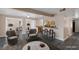 Open floor plan with seating area, bar with stools, and adjoining dining area at 401 Altamira Rd, Las Vegas, NV 89145